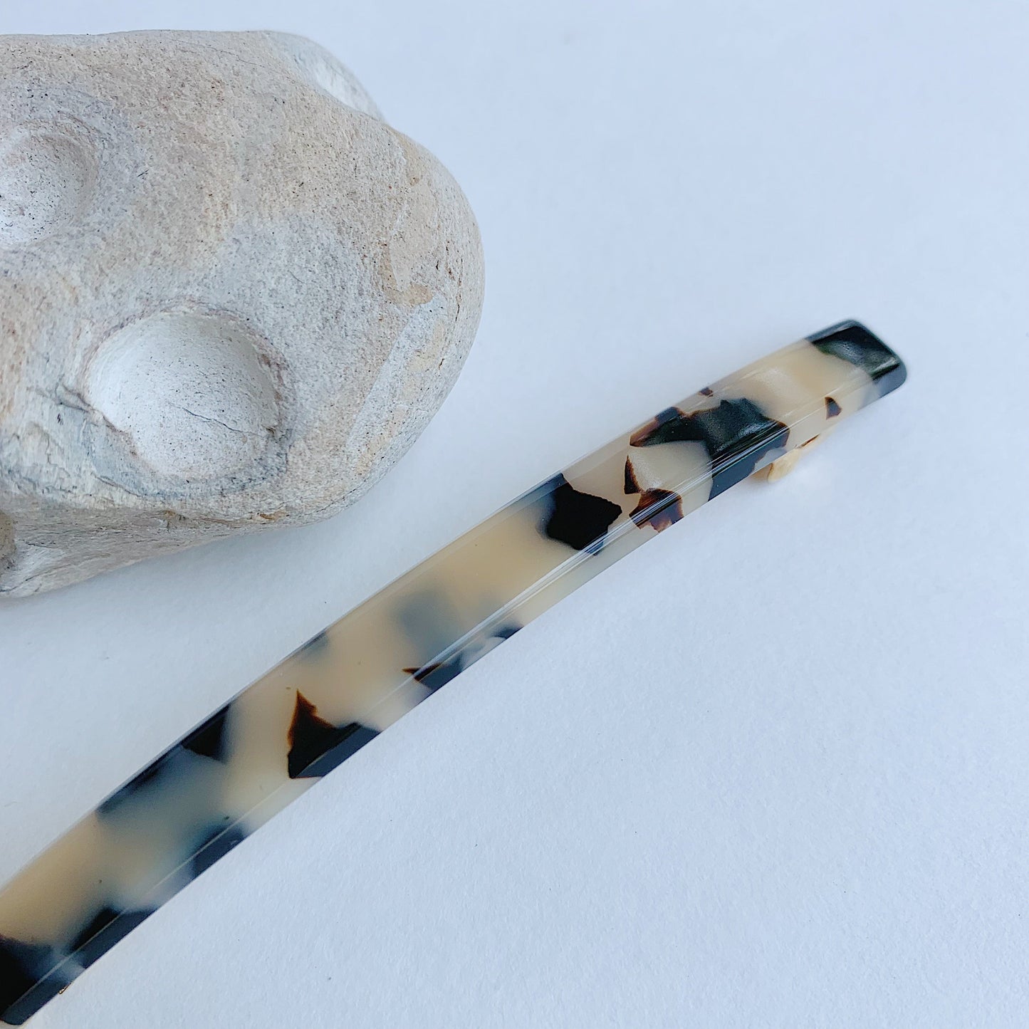 ivory tokyo skinny barrette laydown detail shot with prop