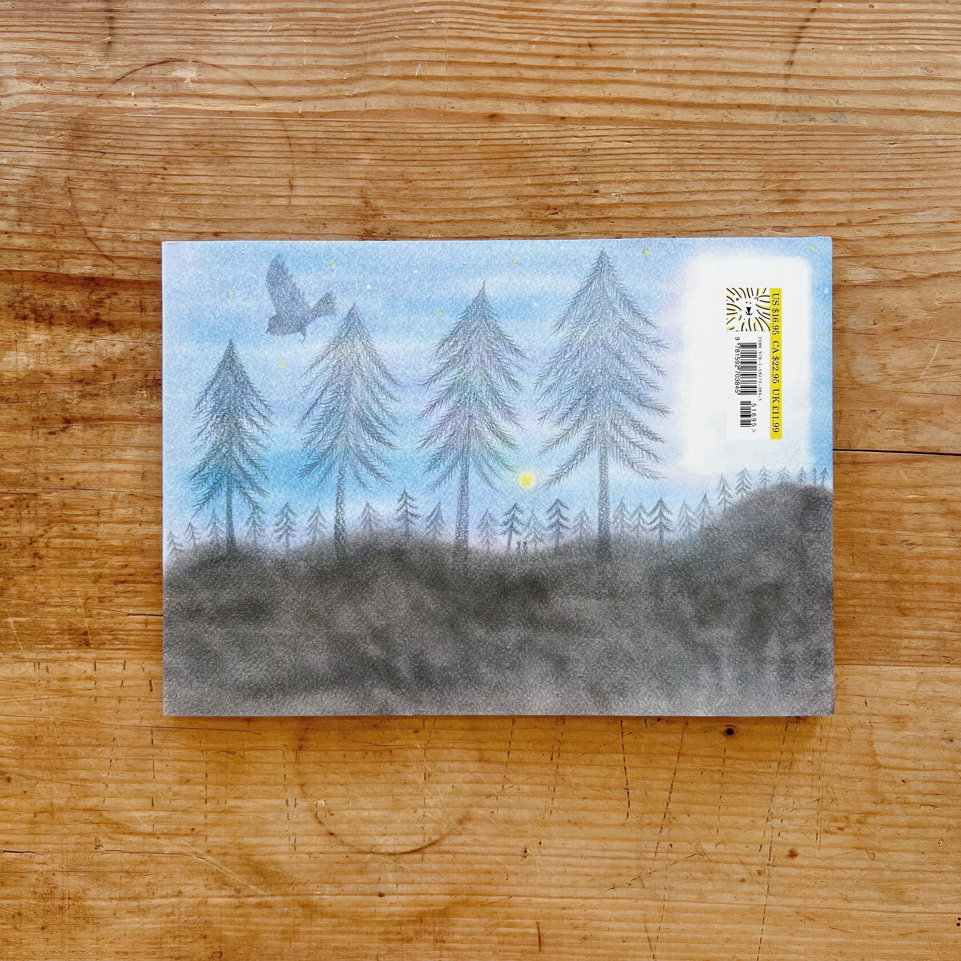 The back cover of the book showing an illustration of a forest, the moon and a bird