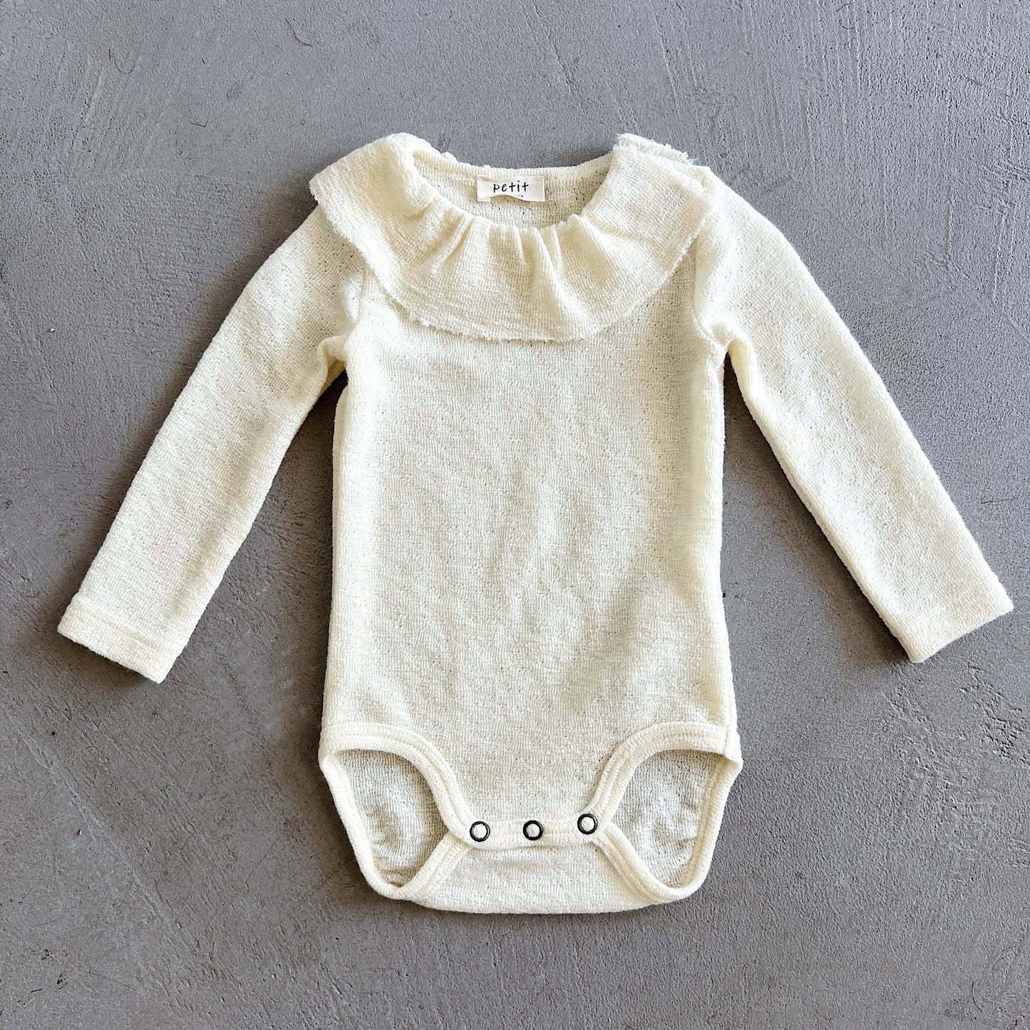 Merino Wool Onesie with Ruffle Collar in Raw White