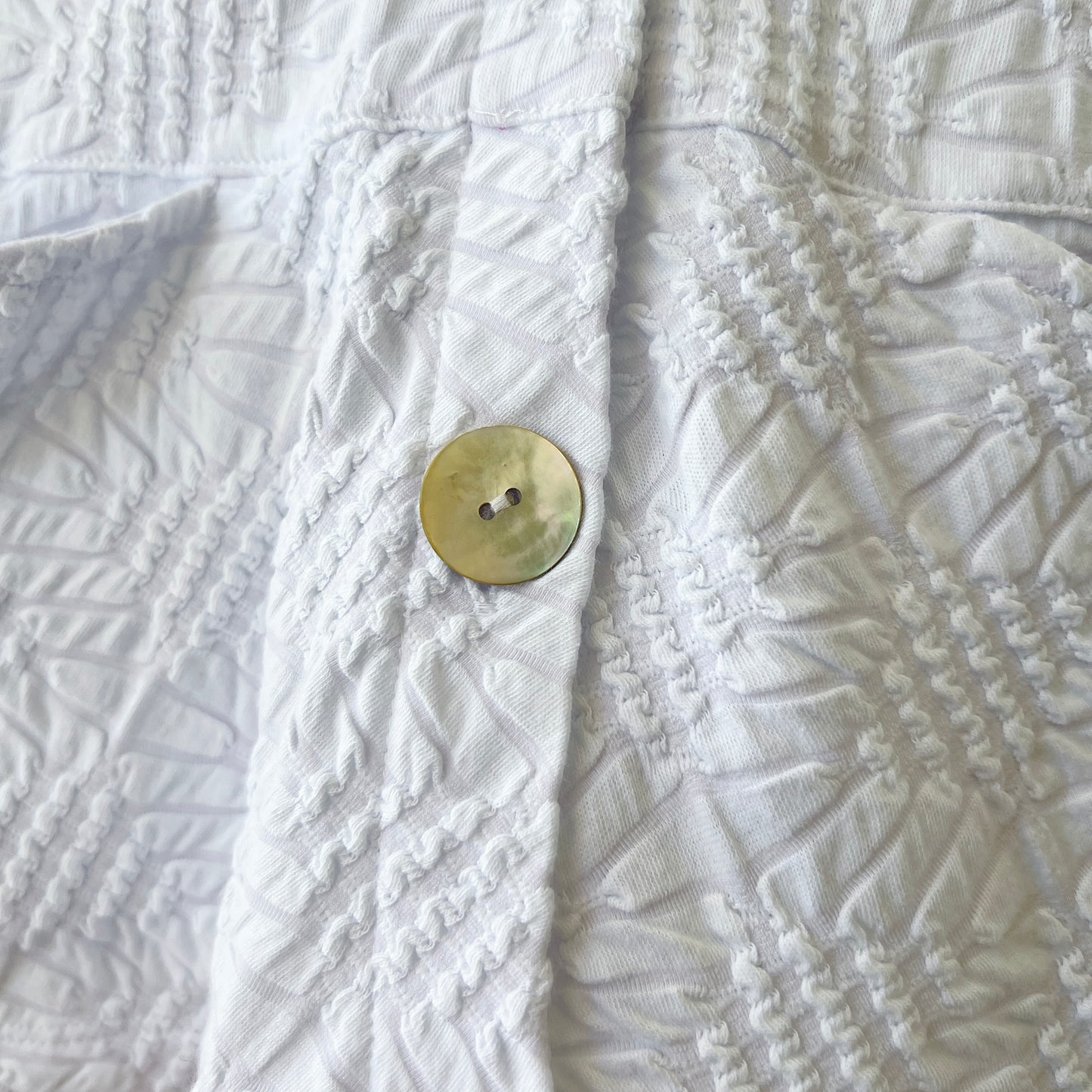 Sunburst Knit Peplum Swing Jacket in White