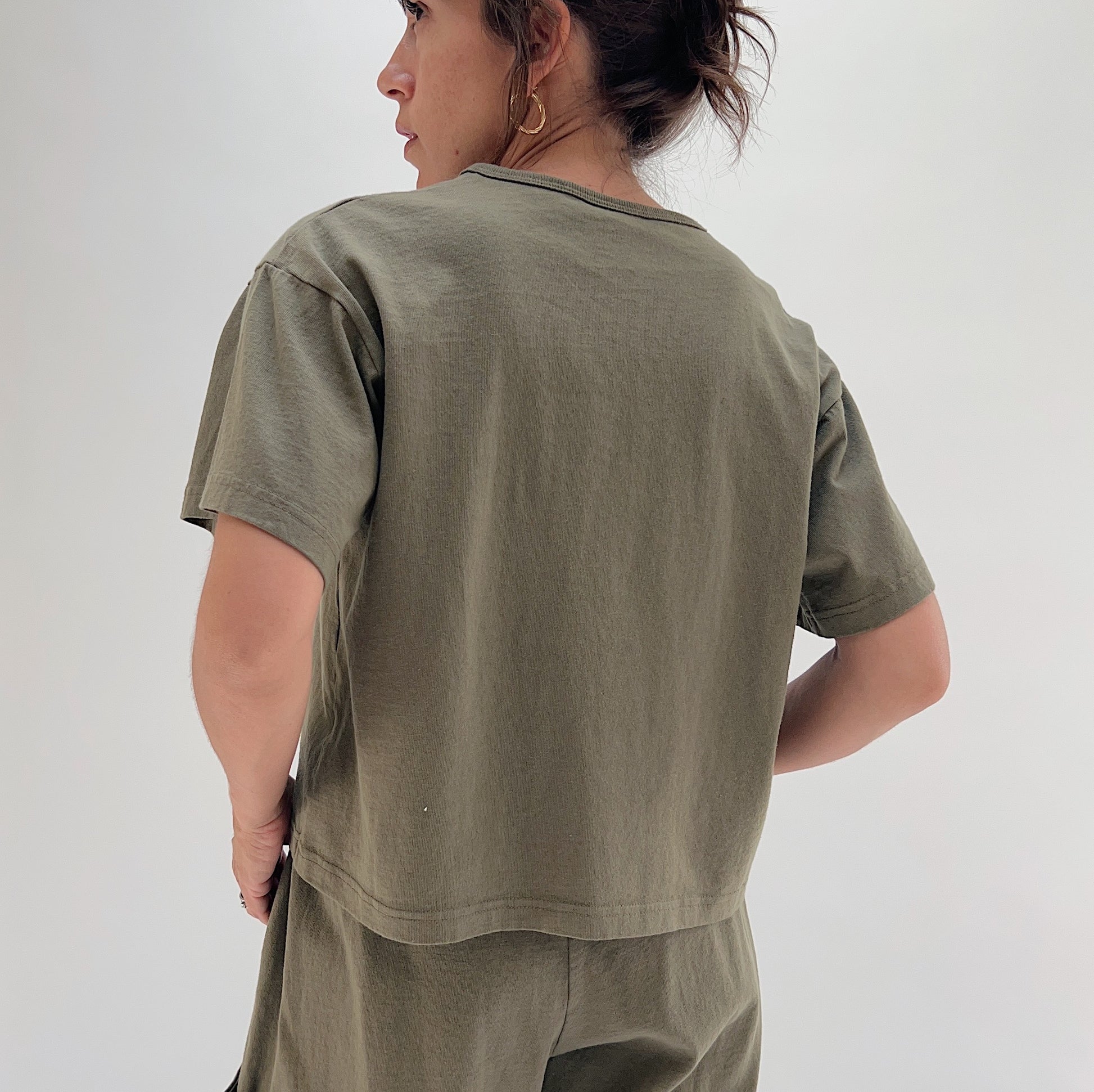 Back view of model wearing Pacific Cotton jasper crop crew tee, showing boxy silhouette, short sleeves, and straight cropped hem