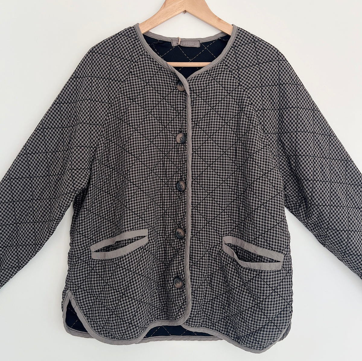 Cut Loose Easy Jacket in Iron Mini Check, close front view showing the mini check pattern, diamond quilting, buttons, and gray-trimmed pockets.
