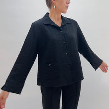 Load image into Gallery viewer, Person wearing a black textured jacket and pants against a white background
