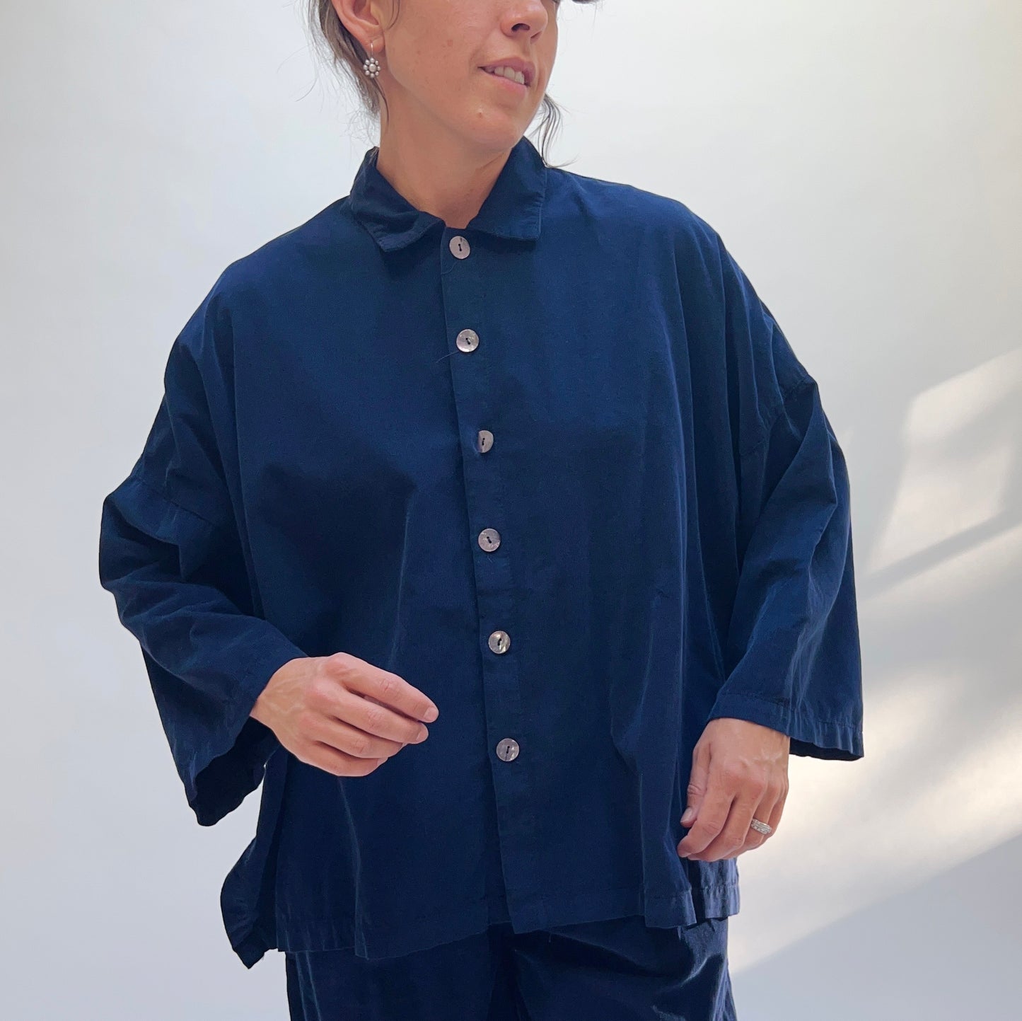 Close-up front view of the Eleven Stitch Corduroy Big Shirt in Indigo, highlighting shell button placket and relaxed fit