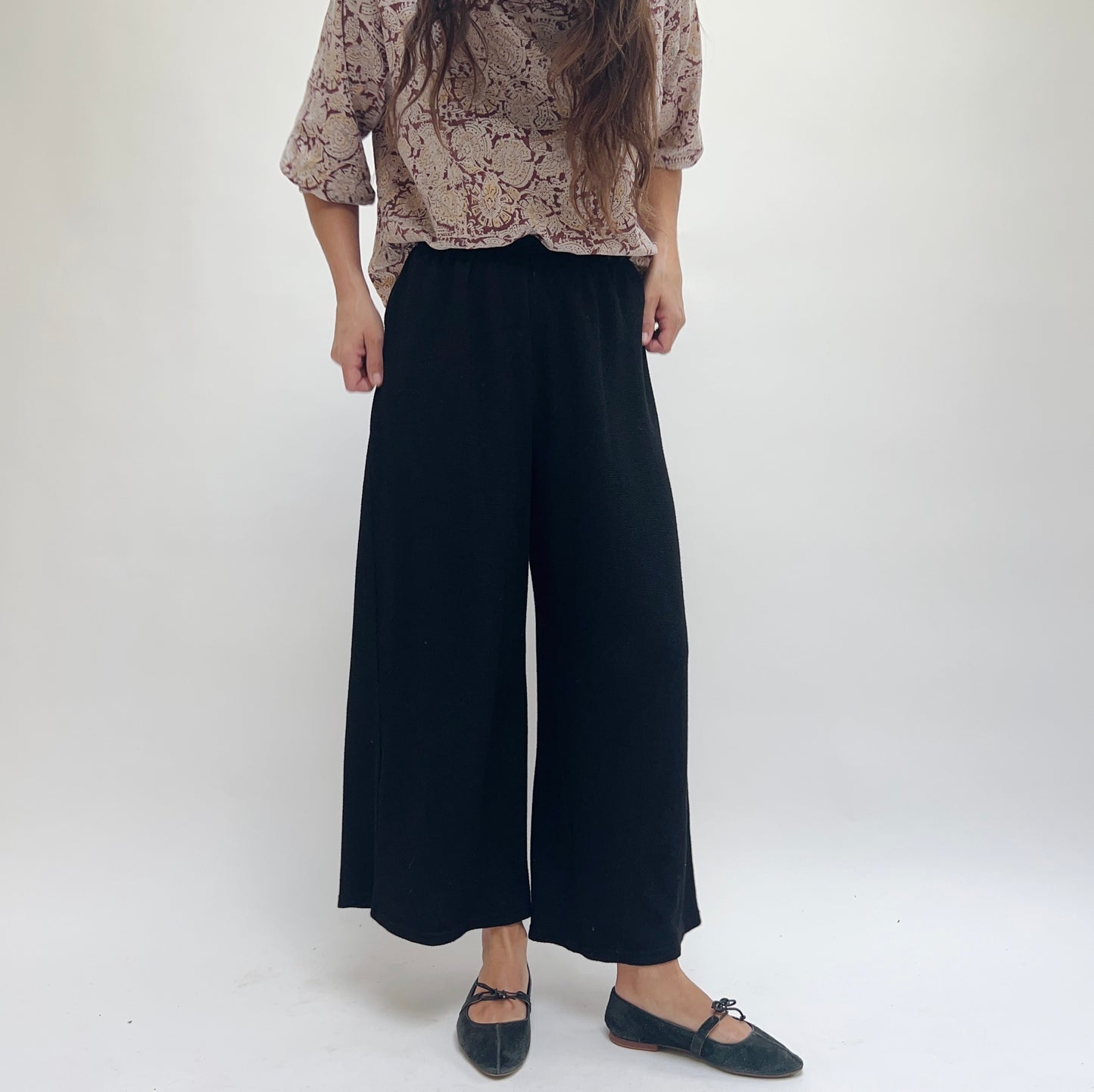 Cut Loose Marled Knit Crop Pant in Black, three-quarter front view highlighting relaxed wide-leg fit and soft knit fabric texture
