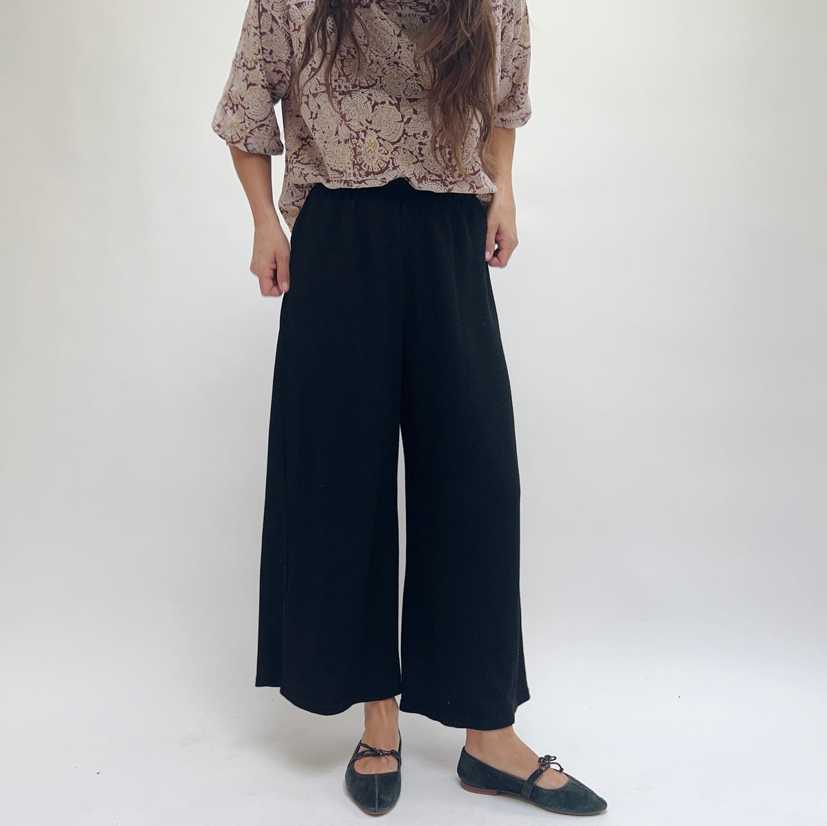 Cut Loose Marled Knit Crop Pant in Black, three-quarter front view highlighting relaxed wide-leg fit and soft knit fabric texture
