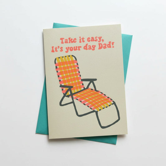 Greeting card with lounge chair illustration and text on a textured surface