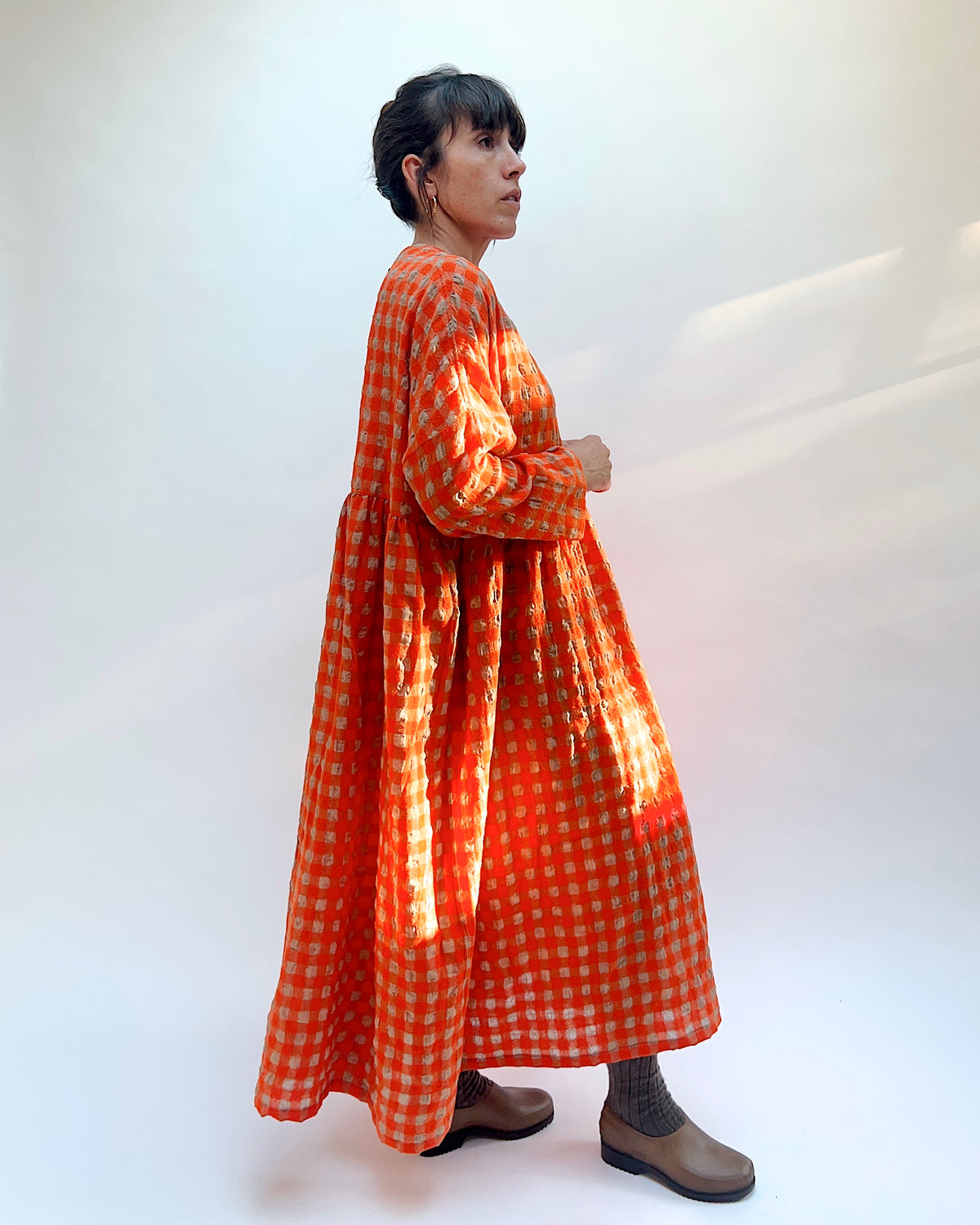 Ichi Antiquités Gingham Wool Check Dress in Beige & Orange, side profile showing the gathered waist and voluminous maxi silhouette
