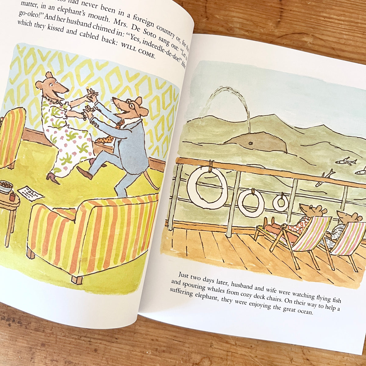 Open pages of Doctor De Soto Goes to Africa showing the mice dancing at home and relaxing on a ship beside a spouting whale.
