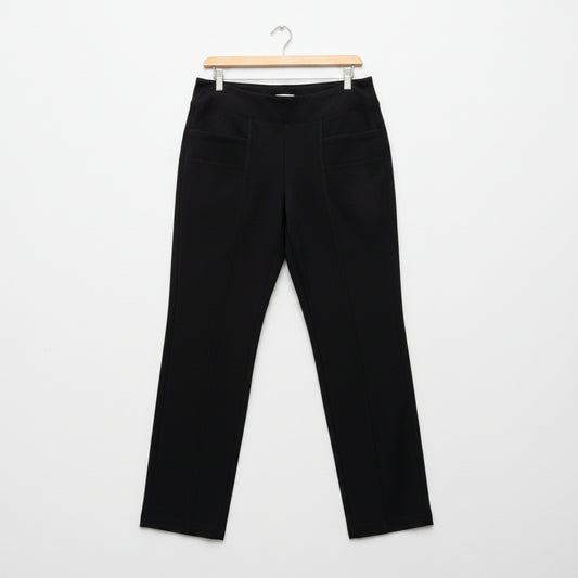 Black pants on a hanger against a white background