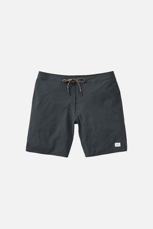 Katin OTG Crest Surf Trunk in Black Wash laid flat on a light grey background, showing the dark charcoal grey board short with a braided drawstring waistband and a small white Katin label on the lower left leg