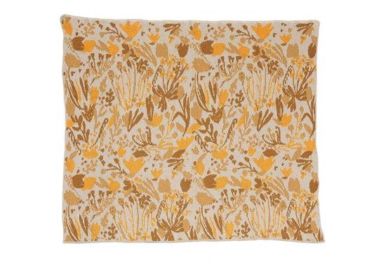 Poppies & Lotus Ocre child blanket laid flat, with golden yellow, tan, and brown flowers on a cream background.
