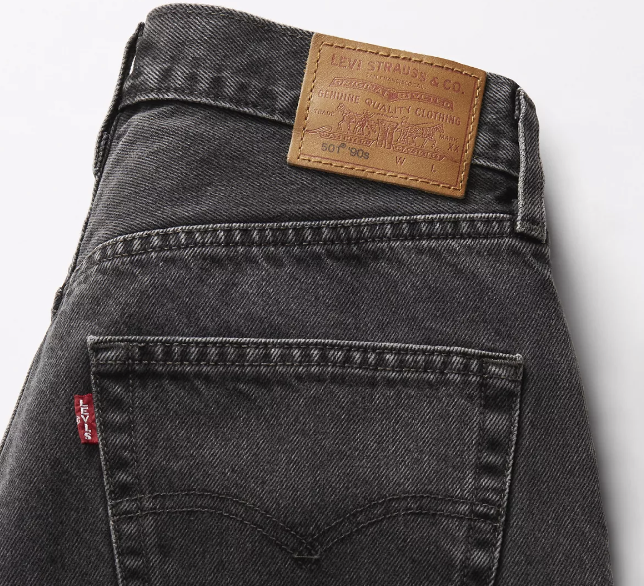 Close-up of a Levi's jeans back pocket with brand label on a white background