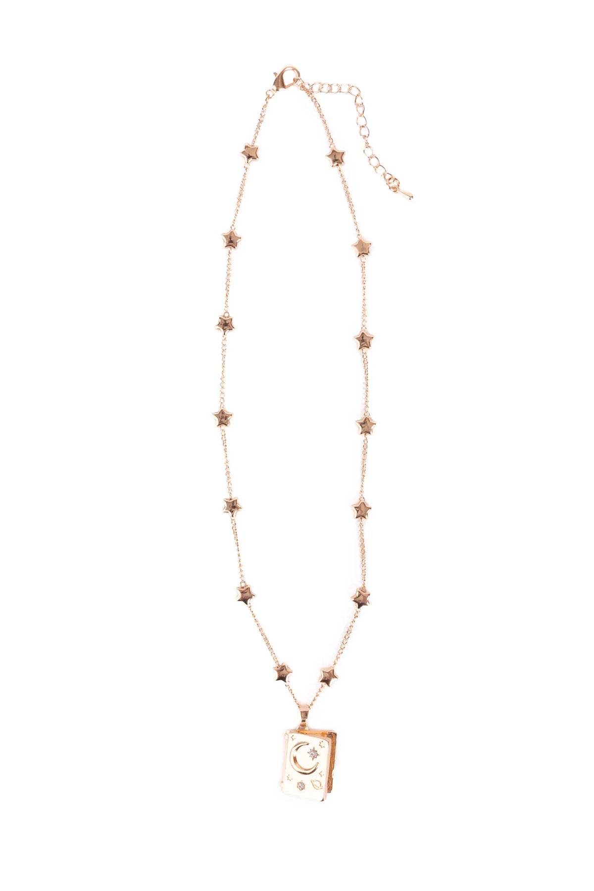 Great Pretenders It Must Be in the Stars Locket, full-length view of a rose gold star charm chain necklace with a book-shaped locket pendant engraved with a crescent moon and stars, on a white background
