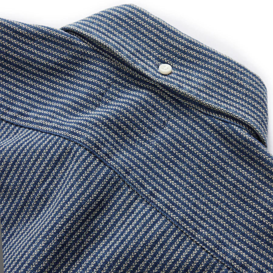 Detail shot of the roped indigo fabric and shoulder seam on The Jack in Roped Indigo by Taylor Stitch, highlighting the rugged woven texture.