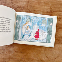 Load image into Gallery viewer, An interior page shot showing an illustration of a small child wearing a red hood and jacket talking to a woman with long golden hair wearing a crown and white dress with a small child on her lap. 
