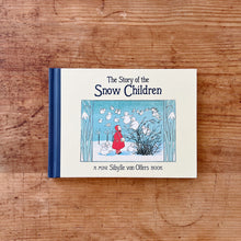 Load image into Gallery viewer, The front cover of Sibylle von Olfers The Story of the Snow Children. The illustration shows a girl dressed in a red hooded jacket looking upward to little snow children floating in the air above her. 
