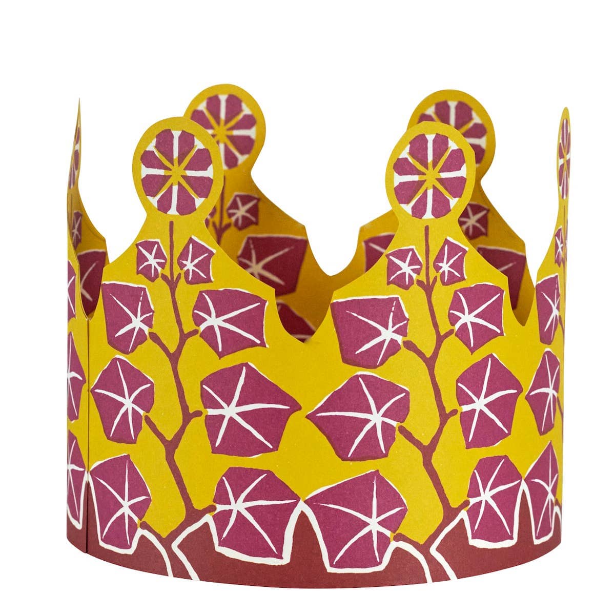 Decorative paper crown with pink floral pattern on a yellow background