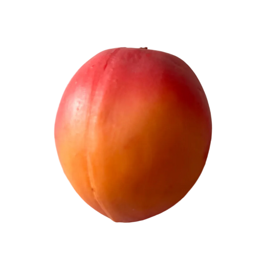Red and orange apricot on a wooden surface