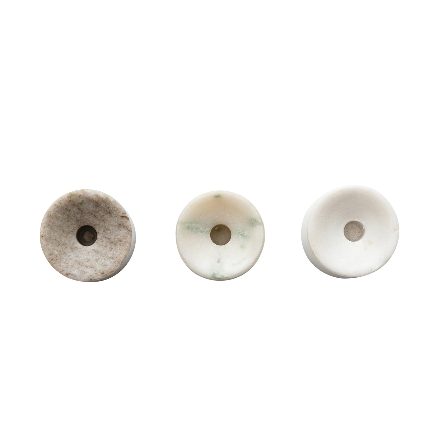 Top view looking down on the 1/2 inch hole of a circular marble taper holder