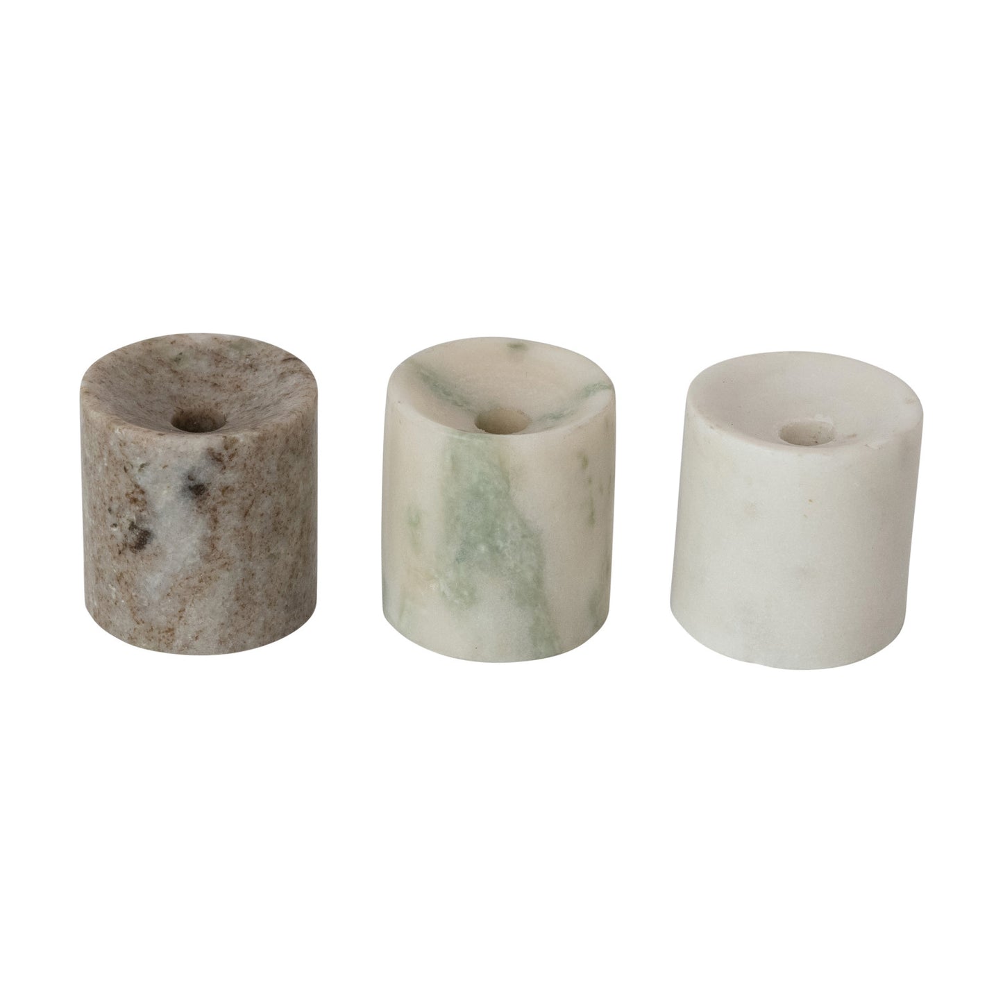Three cylindrical marble candle holders on a white background