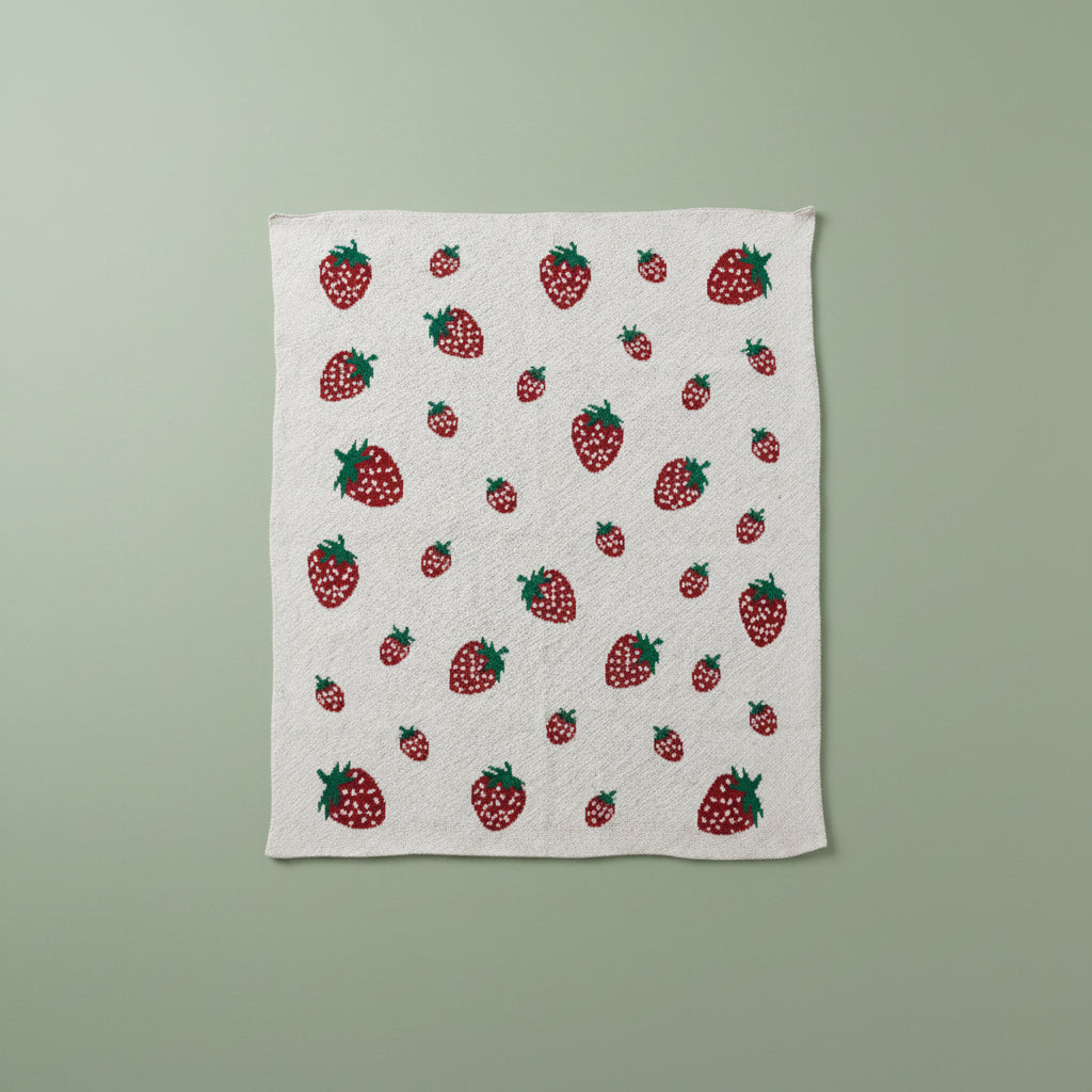Fabric with strawberry pattern on a green background