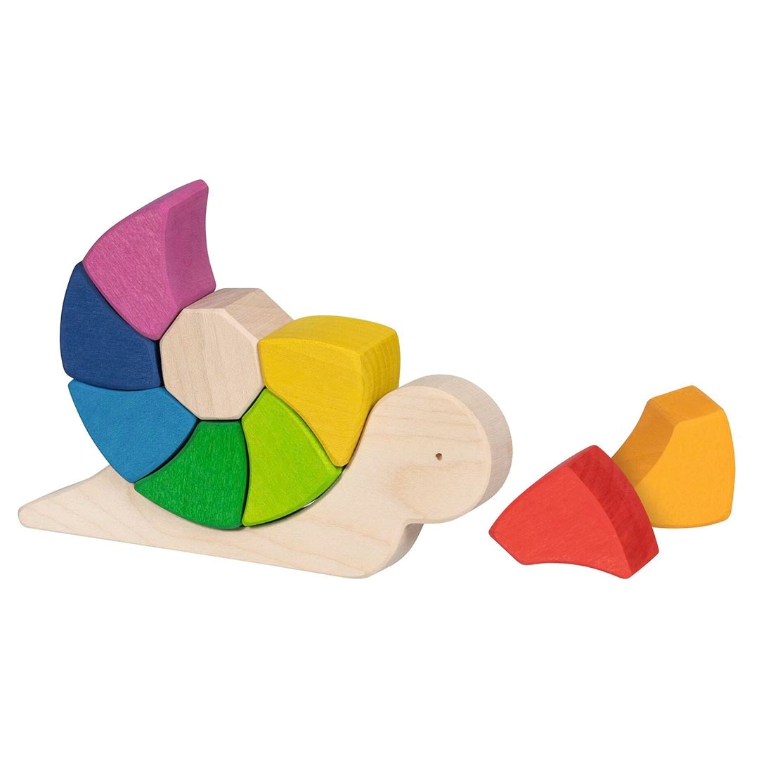 Goki Sassy Snail Puzzle partially assembled on a white background, showing the natural wood snail body with 7 rainbow blocks fitted into the shell and 2 blocks — red and orange — removed and placed beside it to show the puzzle play
