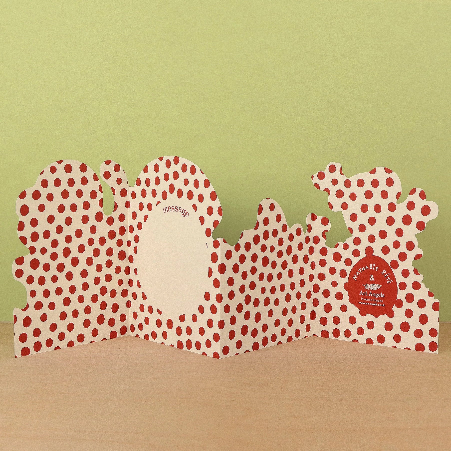 Plushie Party concertina card open to reveal blank message panel on a cream and red polka dot patterned reverse, signed by Nathalie Lété and Art Angels