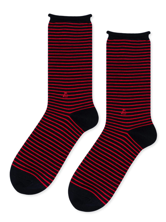 Flat lay view of navy crew socks with narrow red stripes, solid navy heels and toes, and small red sailboat embroidery.
