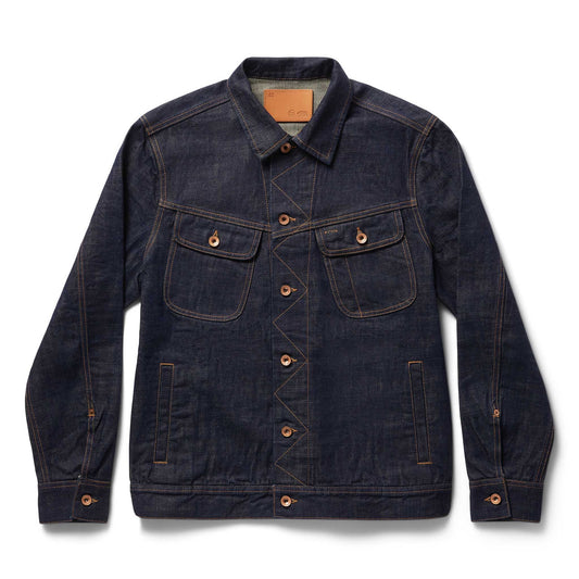 Front view of The Long Haul Jacket in Rinsed Organic Selvedge by Taylor Stitch, showing the dark indigo denim, dual chest pockets, copper buttons, and leather patch at the collar, on a white background