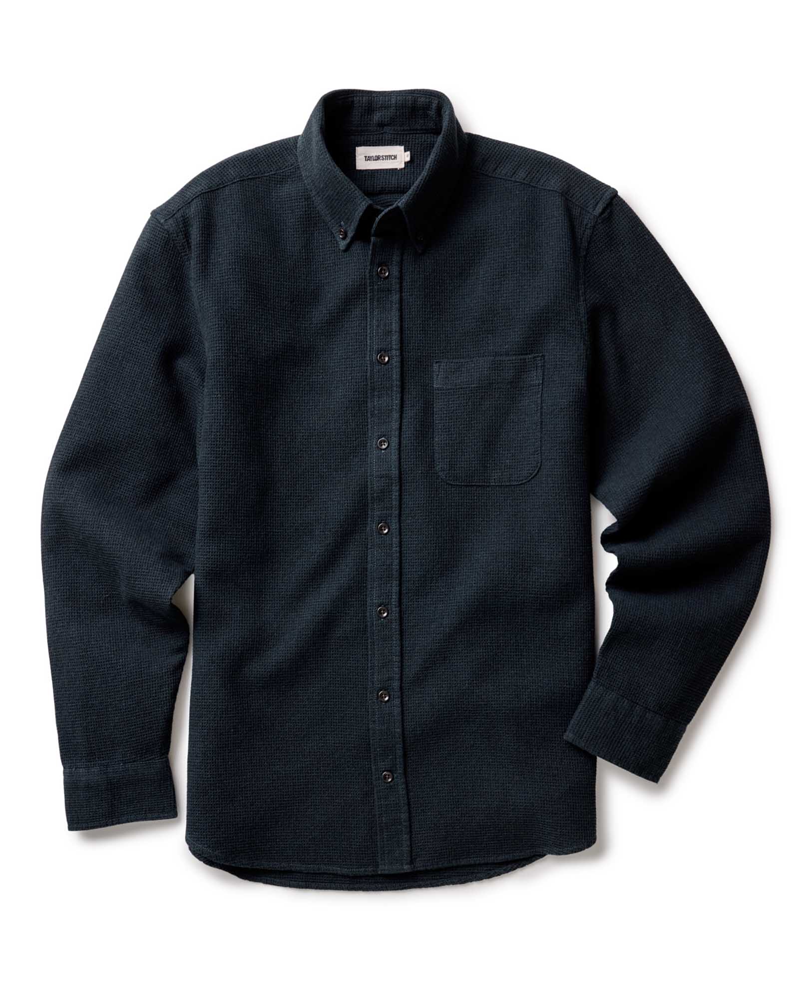 Taylor Stitch Jack Shirt in Forest Waffle, flat lay front view showing dark forest green waffle-knit fabric, button-down collar, chest pocket, and lock-stitched buttons on white background