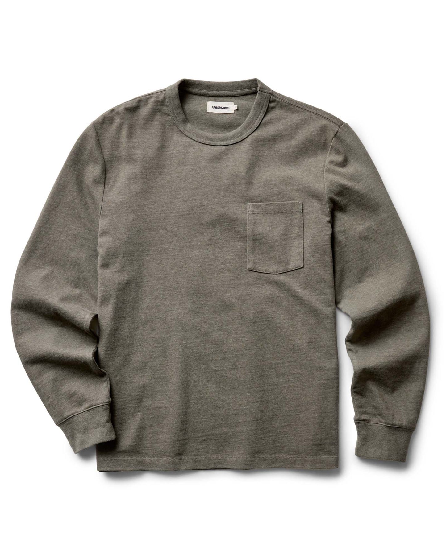 Flat lay of The Long Sleeve Shop Tee in Army Twist by Taylor Stitch — an army green heavyweight cotton long-sleeve tee with a chest pocket and ribbed cuffs, on a white background