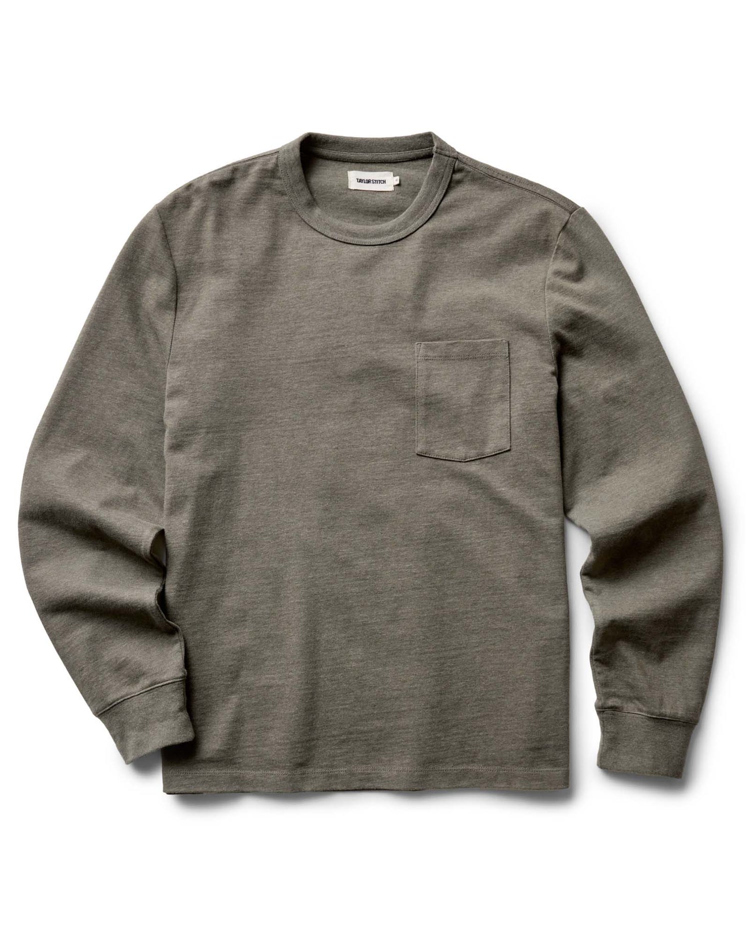 Flat lay of The Long Sleeve Shop Tee in Army Twist by Taylor Stitch — an army green heavyweight cotton long-sleeve tee with a chest pocket and ribbed cuffs, on a white background