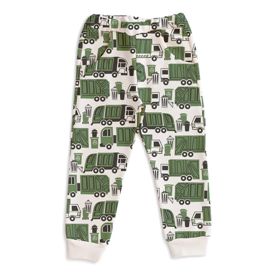 A pair of children's jogger pants with an all-over green garbage truck pattern on a cream background, featuring ribbed cuffs at the ankles.