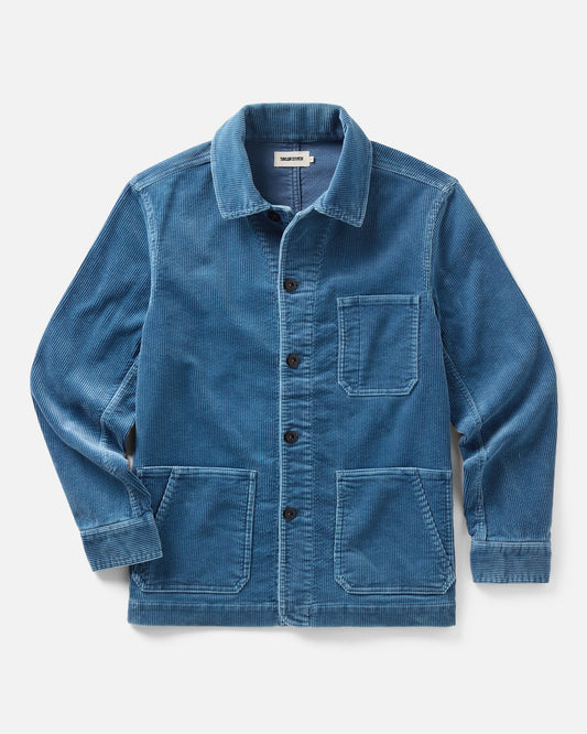 Flat lay view of Taylor Stitch’s Ojai Jacket in Washed Indigo Corduroy, showing the button front, chest pocket, and two lower patch pockets.

