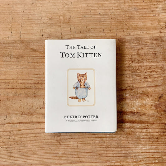 tale of tom kitten cover shot top view laydown on wooden background