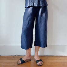 Load image into Gallery viewer, Front view of lower half of model&#39;s legs in navy linen pants and black Birkenstock sandals.
