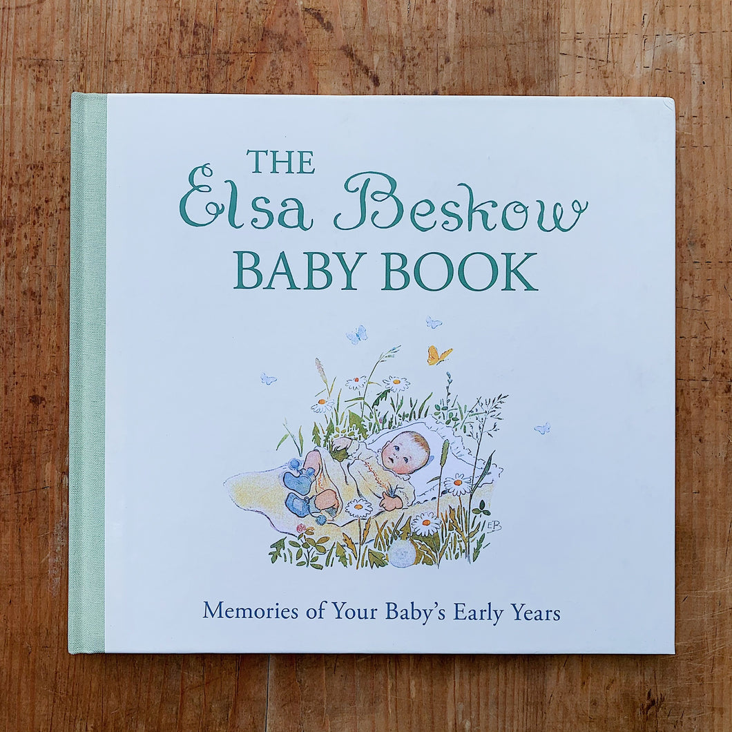 elsa beskow baby book laydown cover shot top view on wooden background
