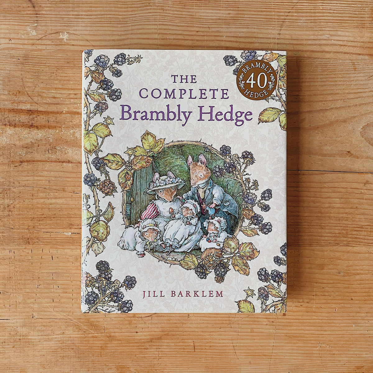 Cover of The Complete Brambly Hedge by Jill Barklem, showing a mouse family surrounded by blackberry vines and a 40th-anniversary badge.
