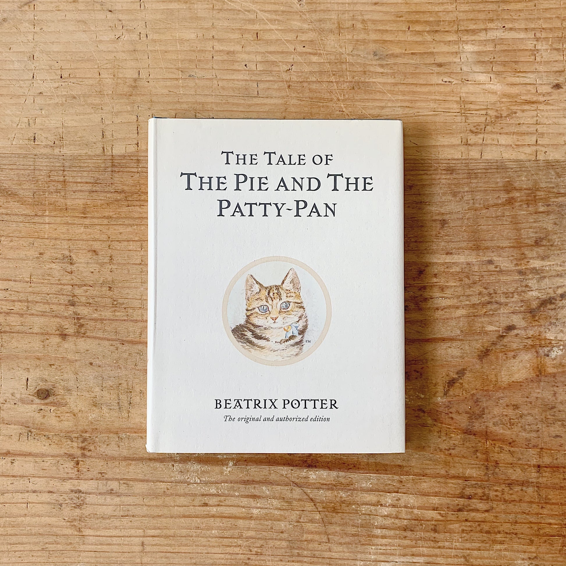 Hardcover book titled 'The Tale of the Pie and the Patty-Pan' by Beatrix Potter, featuring an illustration of a cat on the cover.