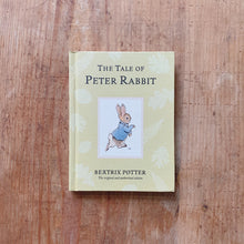Load image into Gallery viewer, tale of peter rabbit laydown cover shot top view on wooden background
