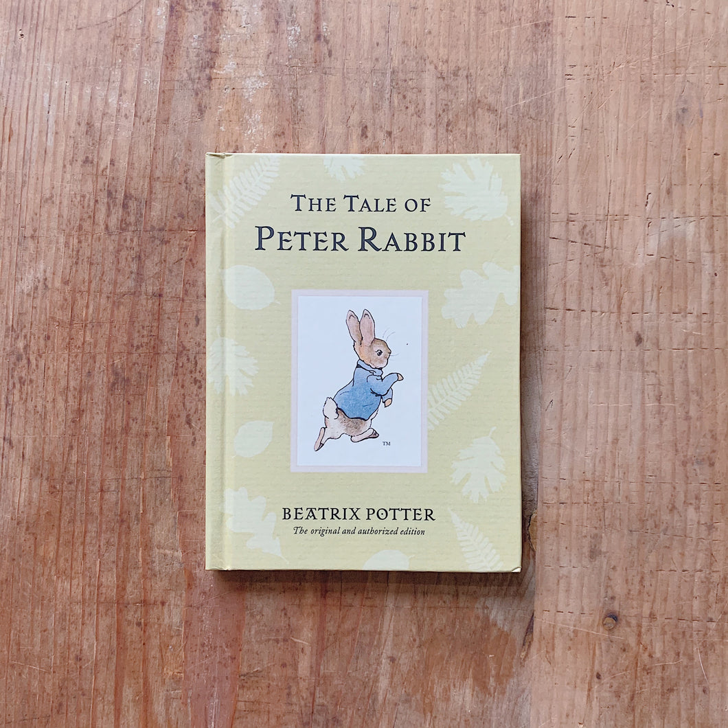 tale of peter rabbit laydown cover shot top view on wooden background