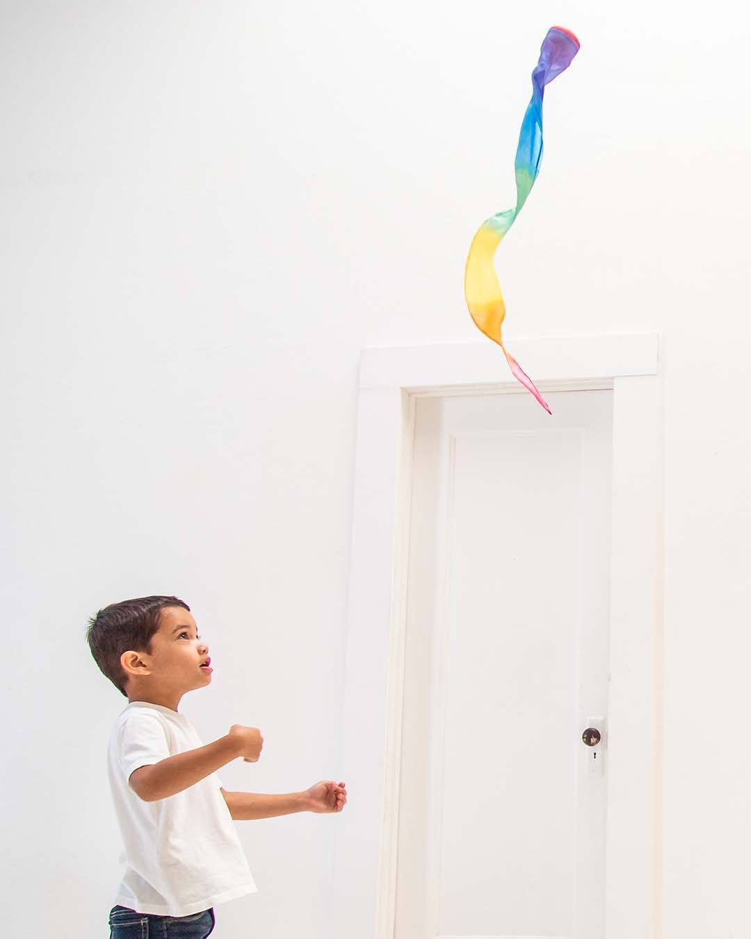 Child throwing the skytail away from himself.
