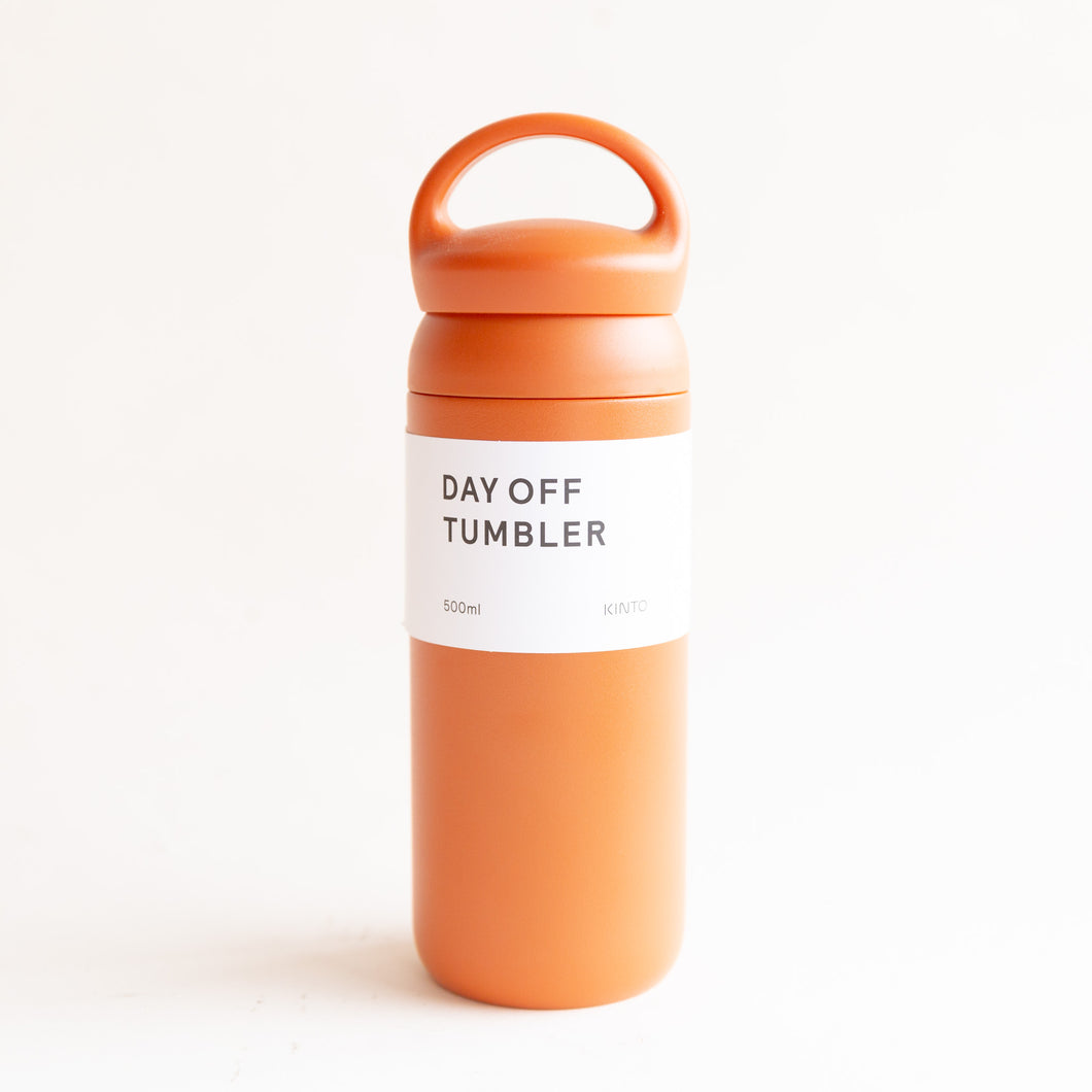 front view of day off tumbler in orange