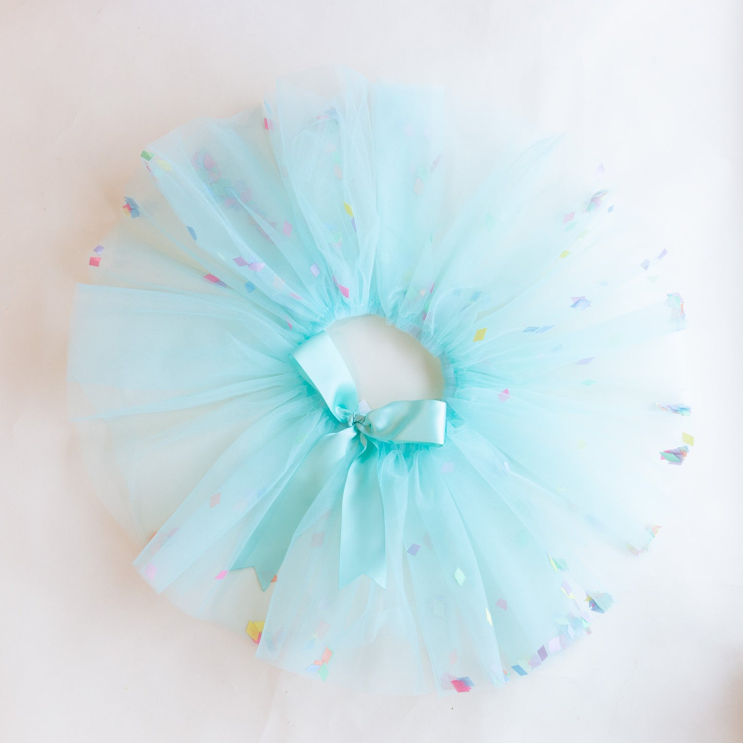 overhead view of turquoise confetti tutu