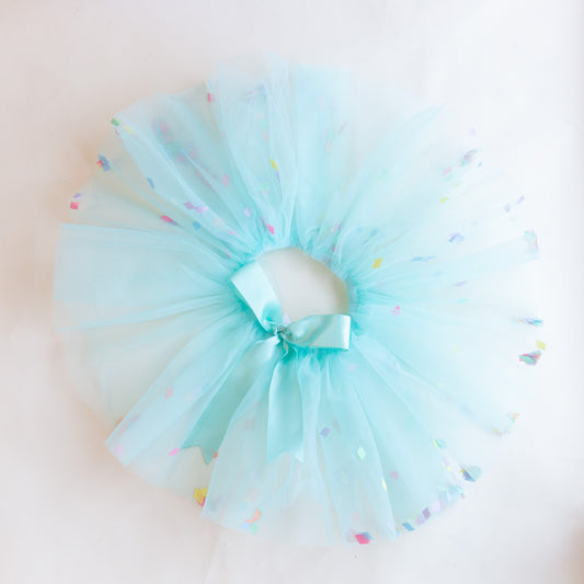 overhead view of turquoise confetti tutu