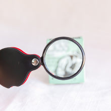 Load image into Gallery viewer, front view of pocket magnifying glass toy
