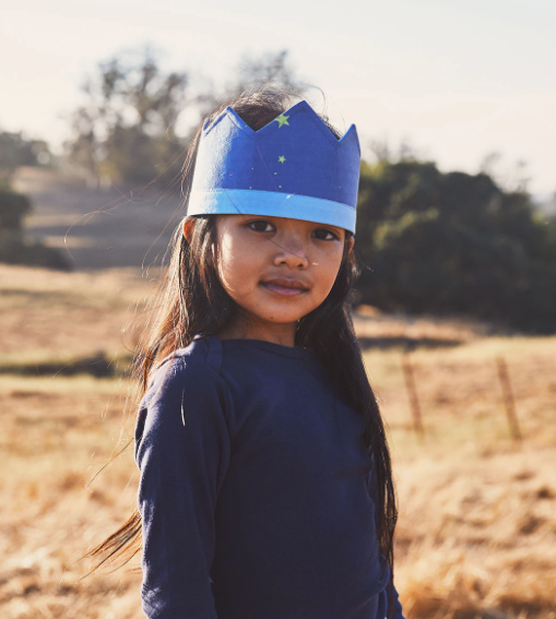 sarah's silks starry night crown seen being worn by model facing the camera
