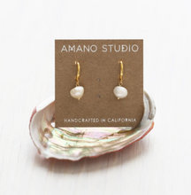 Load image into Gallery viewer, amano studio pearl hoops seen in packaging sitting in an oyster shell
