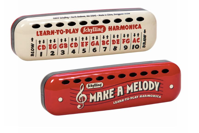 harmonica front and back views out of packaging tilted on white background